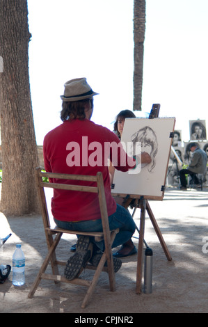 Painter of portrait on public place. Palma Mallorca, Spain Stock Photo