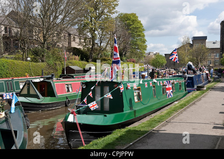 Colourful narrow boats narrowboat narrowboats barge barges on canal Skipton North Yorkshire Dales England UK United Kingdom GB Great Britain Stock Photo