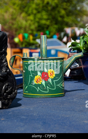 Close up of traditional hand painted decorated watering can on narrow boat narrowboat Skipton North Yorkshire England UK United Kingdom Great Britain Stock Photo