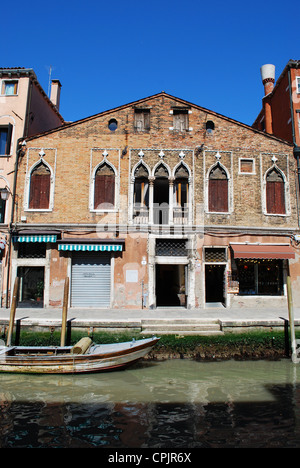 Old house facade and canal on Murano island, Venice, Italy Stock Photo