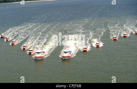 US Coast Guard rapid response boats patrol in formation on the St. John's River May 11, 2011 near Mayport, FL. Stock Photo