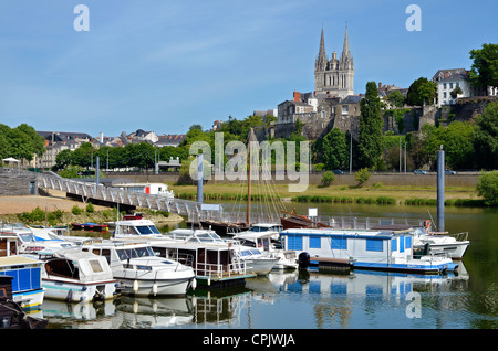 Port on the Maine river of Angers and the cathedral Saint Maurice at the top of hill in the background. Stock Photo