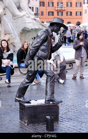 Street performer dressed as a black cowboy in Piazza Navona, Rome. Stock Photo
