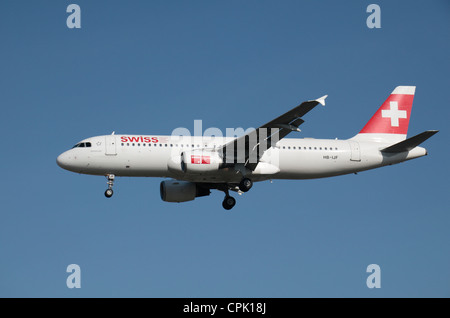 The Swiss International Air Lines Airbus A320-214 (HB-IJF) about to land at Heathrow Airport, London, UK. Feb 2012 Stock Photo