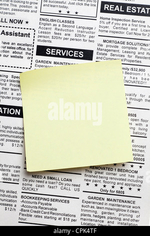 Fake Classified Ad, newspaper and sticky note Stock Photo