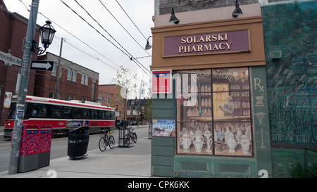 Solarski Pharmacy corner store and tram on Roncesvalles Avenue Toronto Ontario Canada Stock Photo