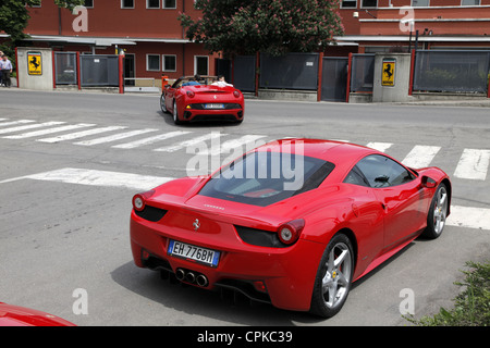 RED FERRARI 458 CARS & FACTORY GATES MARANELLO ITALY 08 May 2012 Stock Photo