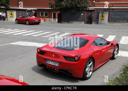 RED FERRARI 458 CARS & FACTORY GATES MARANELLO ITALY 08 May 2012 Stock Photo