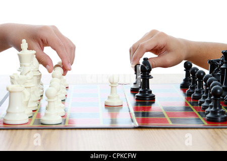 Picture of children playing chess set on white background Stock Photo