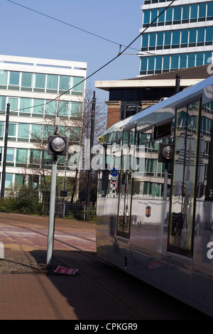 Flexity Swift M5000 class tram stopped at signal near Salford Quays Metro Link stop Salford Greater Manchester England Stock Photo