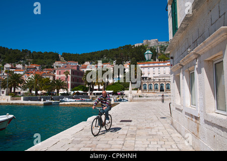 Man on bicycle Hvar town Hvar Island Dalmatia Croatia Europe Stock Photo