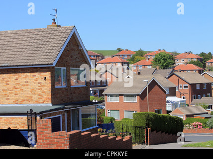 English housing estate with blue sky background. Stock Photo