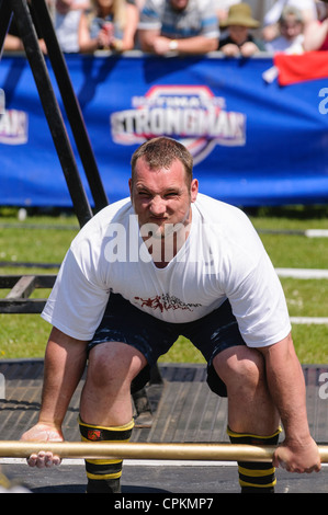 Heavy Lifting. Man Attempting To Lift A Heavy Box By Lowering His Body ...