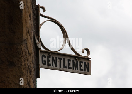 Gentlemen sign outside male public toilets Stock Photo