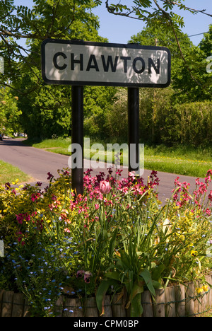 Sign and flower bed for Chawton village, Hampshire, UK. Stock Photo