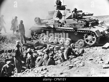 German Panzer IV travelling over a bridge built accross a British trench, Tobruk, Libya, 1942 (b/w photo) Stock Photo