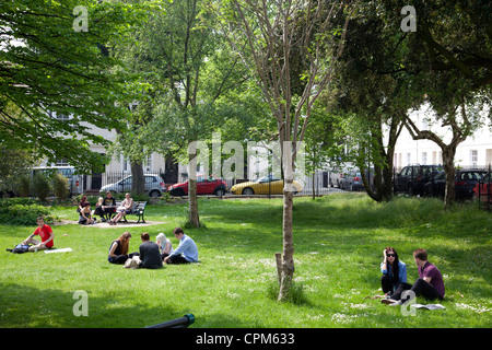People relaxing in residential Pelham Park in Brighton - UK Stock Photo
