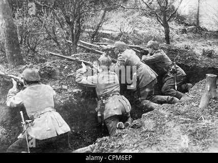 German soldiers wearing spiked helmets and carrying ammunition ...