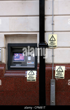 Wet Pant sign around a Cashpoint Machine Stock Photo