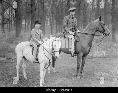 King George VI with Princess Elizabeth on horseback, 1936 Stock Photo