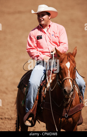 A competitor in the tie down roping competition sits on his horse at the 90th annual Black Hills Roundup rodeo on July 4, 2009. Stock Photo