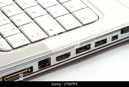 Multiple ports on side of a white notebook Stock Photo