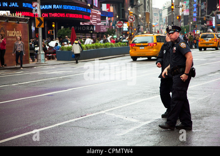 Police officers patrolling Times Square, New York City, USA Stock Photo ...