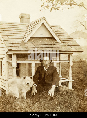 Cigar Smoking Man & Dog with Architectural Doghouse Stock Photo