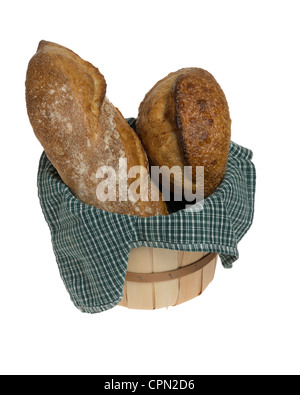 Two loaves of fresh bread in wicker basket Stock Photo