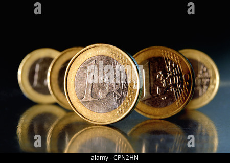 1 Euro coins in front of black background Stock Photo