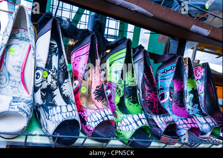 London Camden Town Lock Market display ladies girls womans high heeled fantasy shoes open toes toed patterns pictures quirky fashionable design Stock Photo