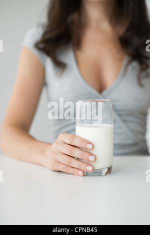 Woman holding glass of milk Stock Photo