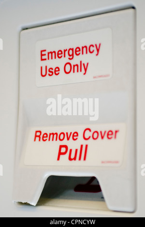 Emergency exit lever in airplane Stock Photo