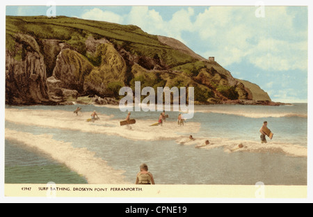 Tinted postcard of early surfing in Cornwall with wooden boards, Droskyn Point, Perranporth beach, Cornwall, U.K. circa 1920's Stock Photo