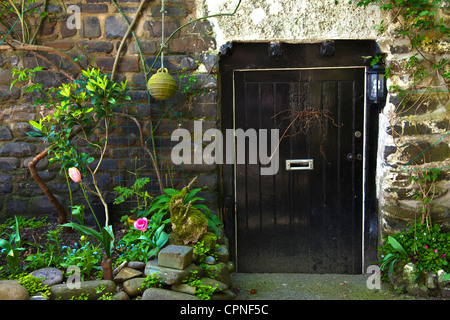 Black Front Door to Crazy Kate's Cottage in Clovelly North Devon Stock Photo