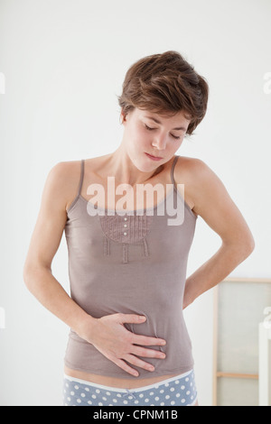 ABDOMINAL PAIN IN AN ADOLESCENT Stock Photo