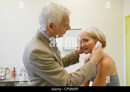 TEMPERATURE ELDERLY PERSON Stock Photo