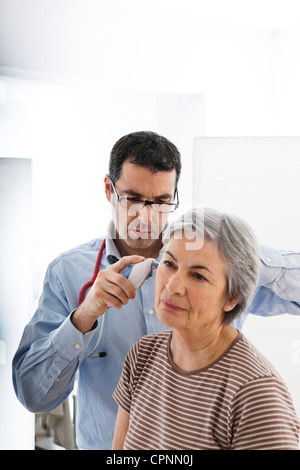 TEMPERATURE ELDERLY PERSON Stock Photo