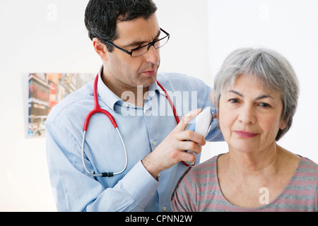 TEMPERATURE ELDERLY PERSON Stock Photo