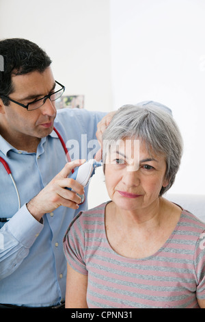 TEMPERATURE ELDERLY PERSON Stock Photo