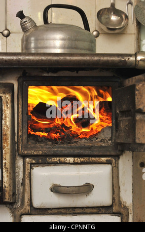 fire, open hearth, kettle on the hearth, fire in stove, hearth from the period circa 1900, Germany, Additional-Rights-Clearance-Info-Not-Available Stock Photo