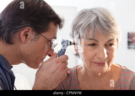 EAR NOSE &THROAT, ELDERLY PERSON Stock Photo