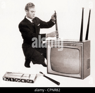 broadcast,television,television set,Graetz Markgraf F 703,tabletop unit becoming standalone device with four adjustable sockets,construction kit of the Graetz Company,with 59 centimeter screen size,chassis: walnut tree,Germany,1964,monochrome television set,standalone device,TV history,interior furnishings,60s,clipping,cut out,cut-out,cut-outs,table-leg,leg of the table,foot,feet,modification,television furniture,piece of furniture,pieces of furniture,self-build,television set,TV,television sets,TV sets,TVs,TV set,tube televisi,Additional-Rights-Clearences-Not Available Stock Photo