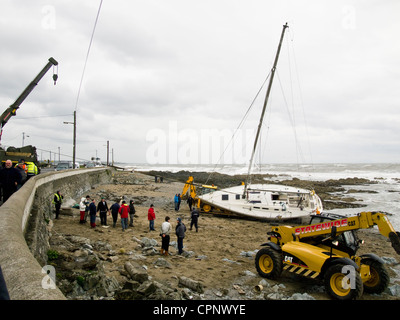Yachts thrown up on the rocks at Skerries, county Dublin, Ireland after a spring storm in 2012 Stock Photo