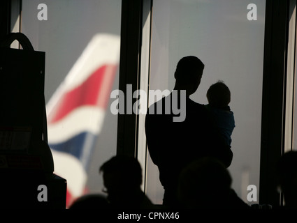 British Airways passengers at London Heathrow wait for flights Stock Photo