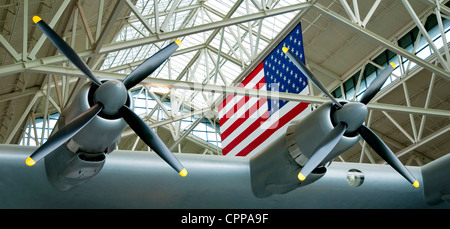The American flag proudly hangs behind the wing of the Spruce Goose Stock Photo