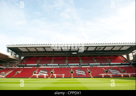 Stands and pitch at Anfield when empty. Set of UV lights are on pitch to encourage grass growth. Stock Photo