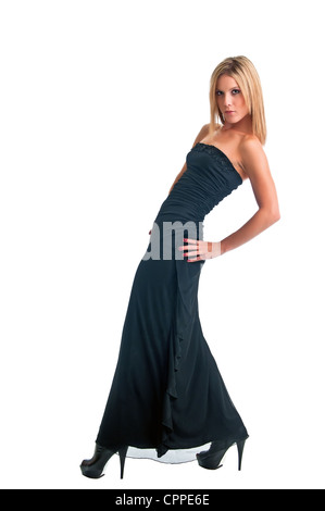 Pretty blonde confidently showing her close fitting gown against a white background Stock Photo