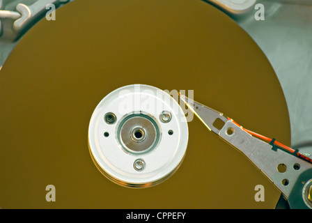 Inside of a desktop computer hard drive showing the platters and read-write arm and head. Stock Photo