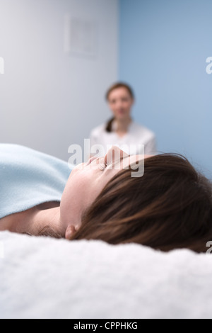 Nurse watching sleeping patient Stock Photo